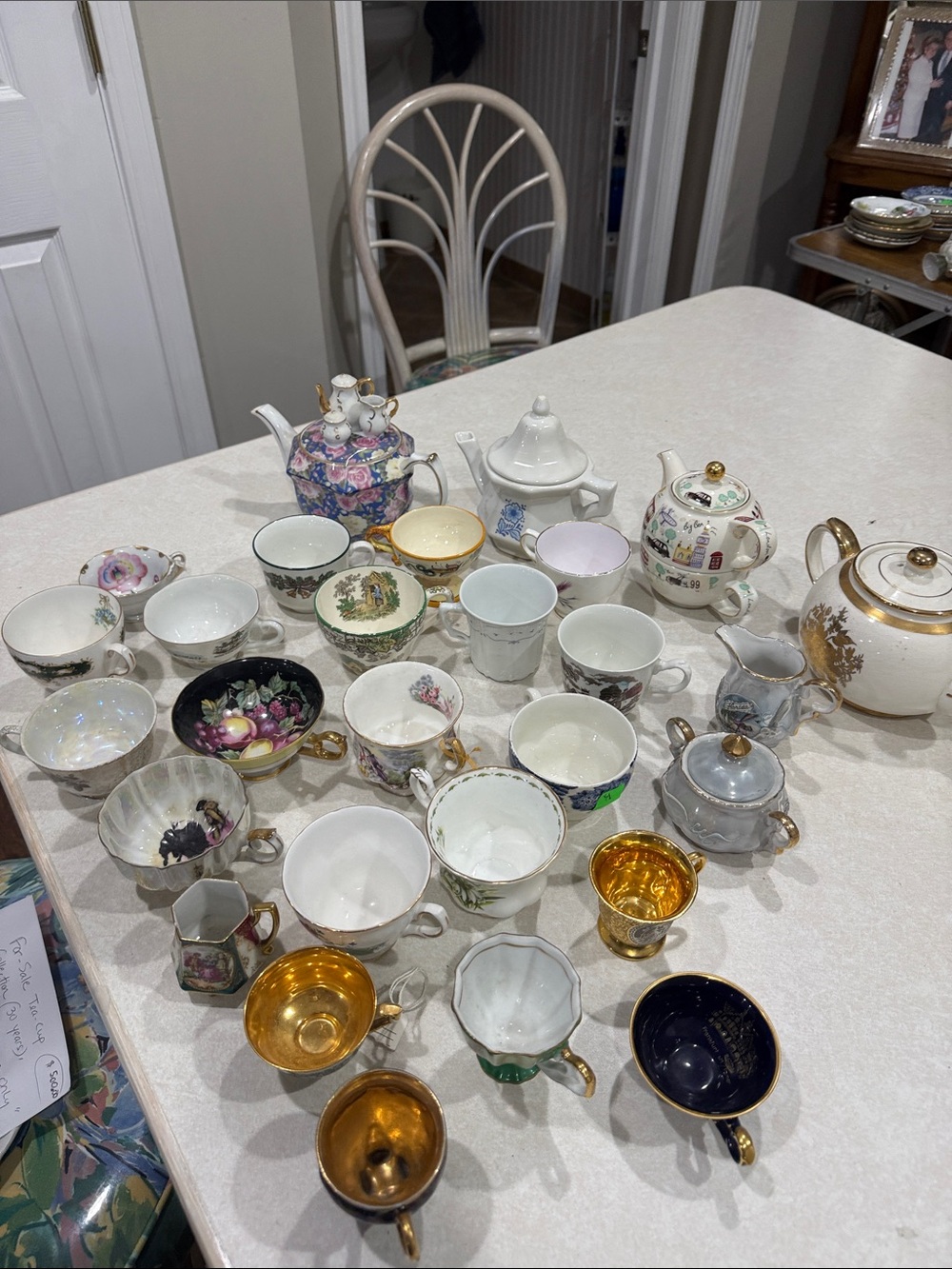 vintage 35 year-old collection, tea, cups, and saucers, along with four tea pots